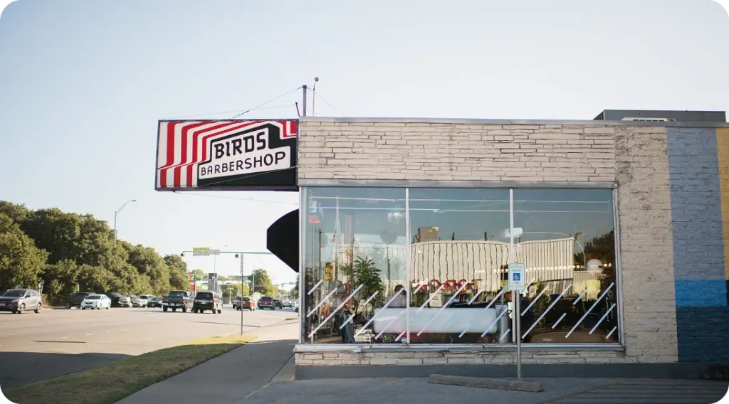 S. Congress Birds Barbershop storefront with street-facing windows